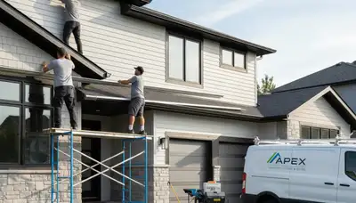 Technician installing seamless gutters on vinyl siding home in Pittsburgh, PA